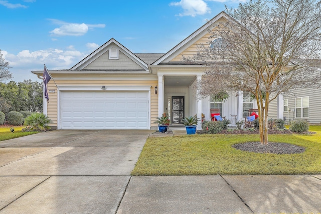 view of front of house featuring a garage and a front yard