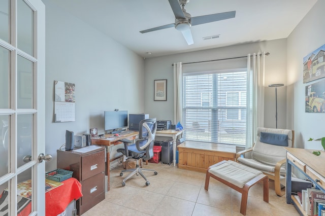 tiled office featuring ceiling fan