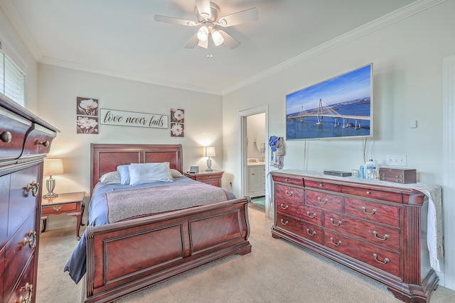 bedroom featuring ceiling fan, ensuite bathroom, ornamental molding, and light carpet