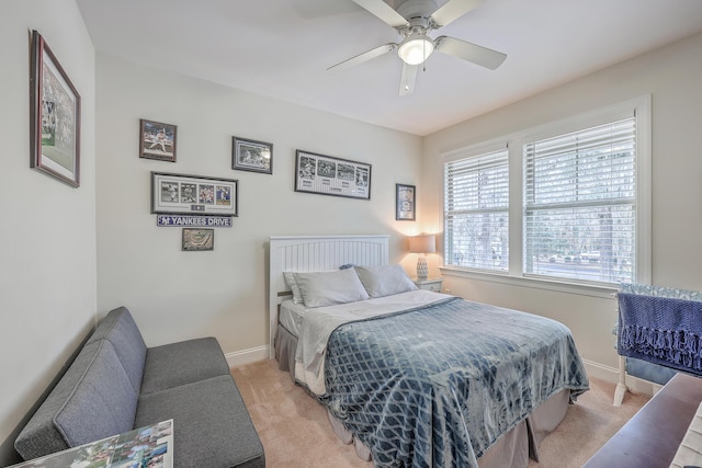 bedroom featuring ceiling fan and light colored carpet