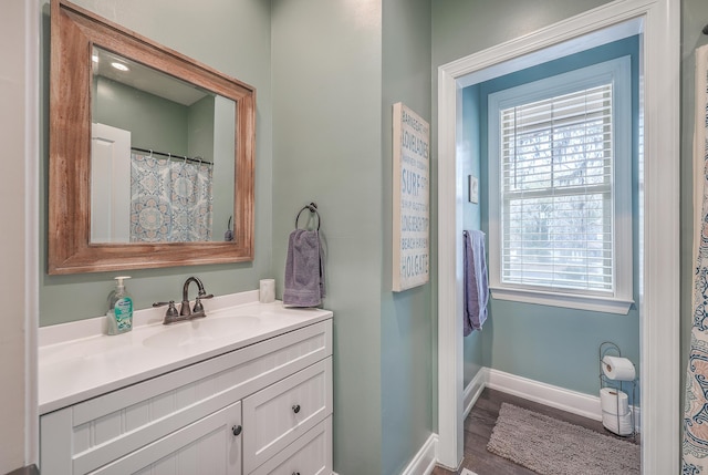 bathroom featuring hardwood / wood-style floors and vanity