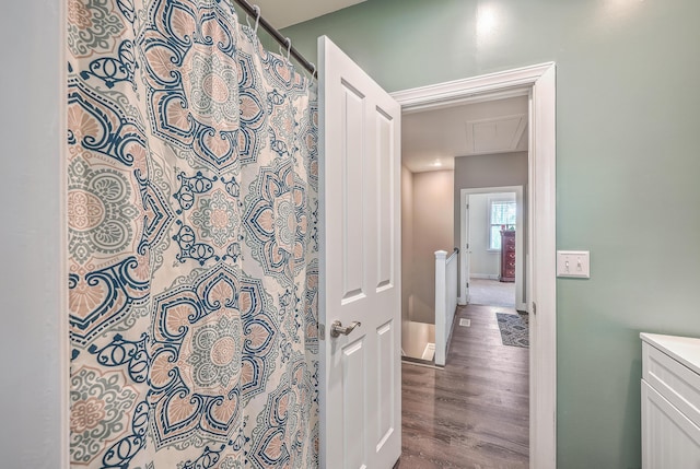 bathroom with a shower with shower curtain, vanity, and hardwood / wood-style floors