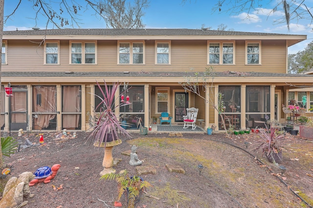 view of front of property featuring a sunroom