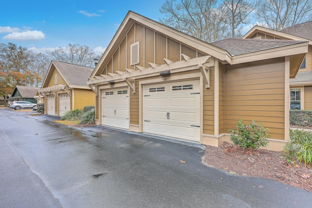 view of side of property with a garage