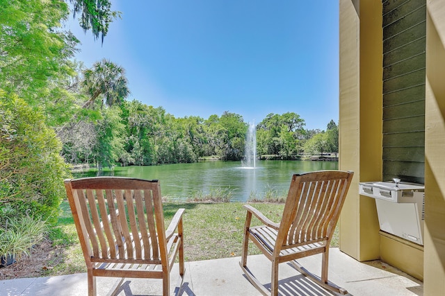 view of patio featuring a water view