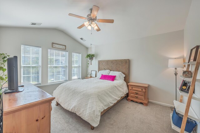 carpeted bedroom featuring ceiling fan and vaulted ceiling