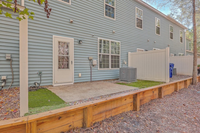 back of property featuring a patio and central AC unit