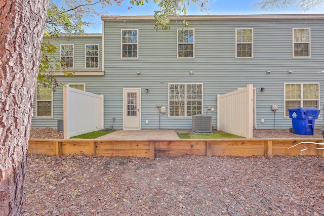 rear view of property featuring central air condition unit