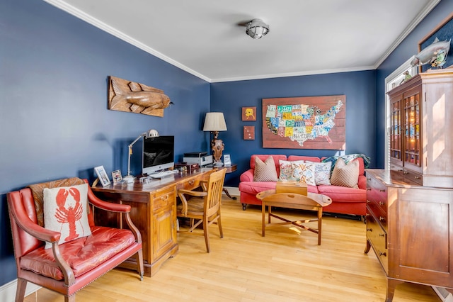 home office featuring ornamental molding and light wood-style floors