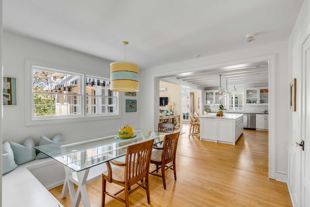 dining room with light wood-type flooring and breakfast area