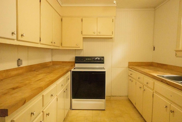 kitchen with butcher block countertops, white range with electric cooktop, and ornamental molding