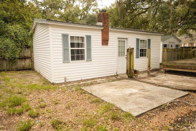 rear view of property with a patio area and a deck