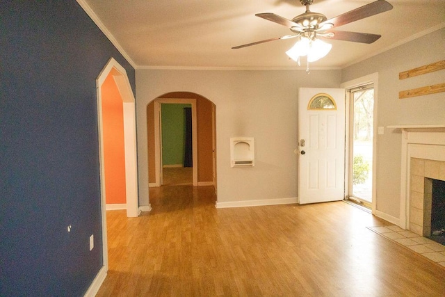 unfurnished living room featuring a fireplace, plenty of natural light, and light wood-type flooring