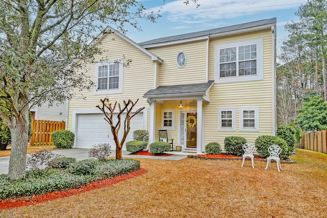 view of front of home with a garage and a front lawn