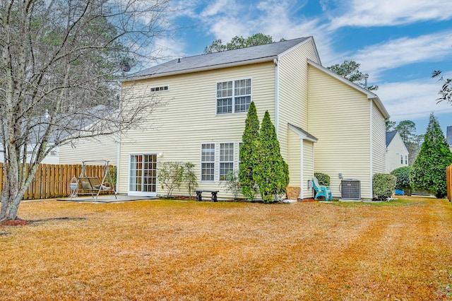 back of house featuring a yard, a patio area, and central air condition unit