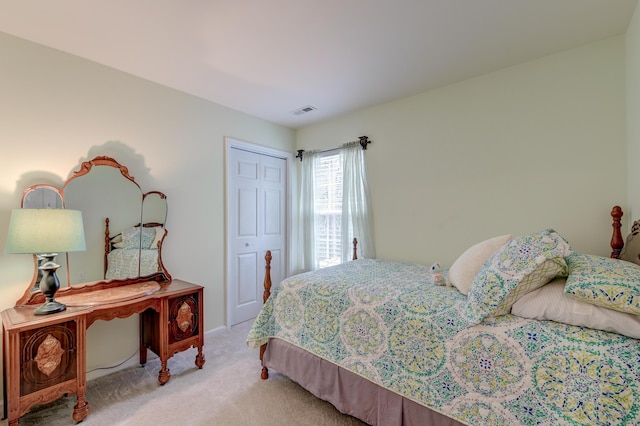 carpeted bedroom featuring a closet