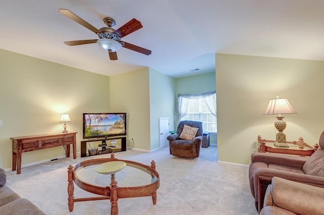 carpeted living room featuring ceiling fan