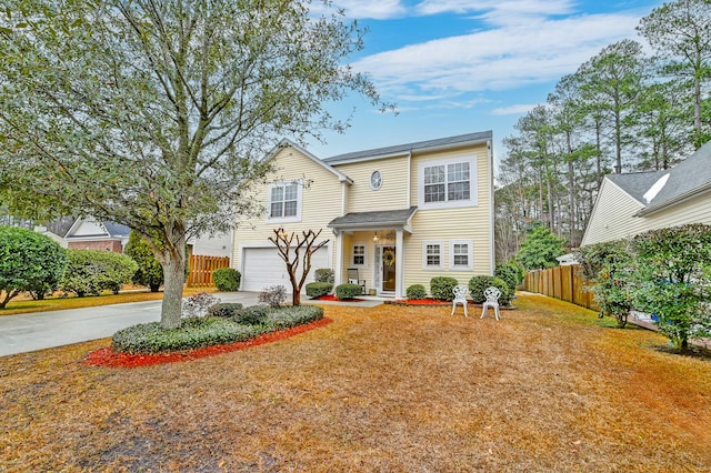 view of front of property featuring a garage and a front yard