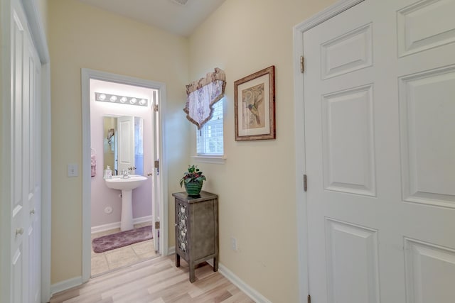 corridor featuring light hardwood / wood-style floors