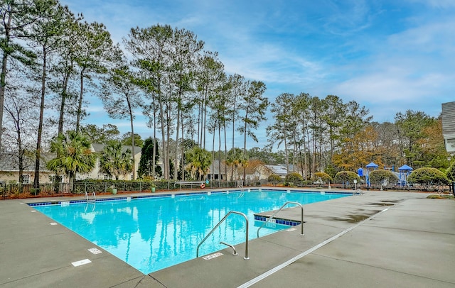 view of swimming pool featuring a patio