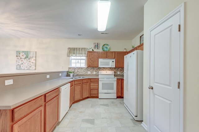 kitchen with white appliances, sink, and decorative backsplash