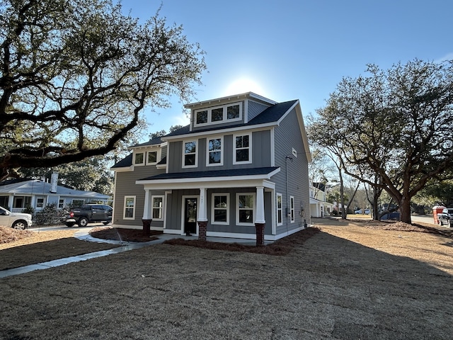 traditional style home with covered porch and board and batten siding