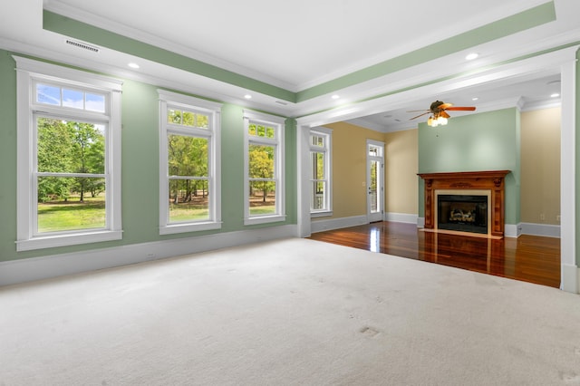 unfurnished living room featuring crown molding, visible vents, baseboards, and recessed lighting