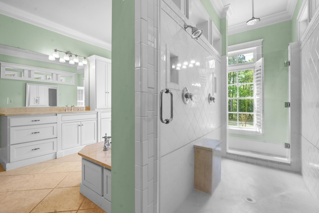 bathroom with a stall shower, vanity, crown molding, and tile patterned floors