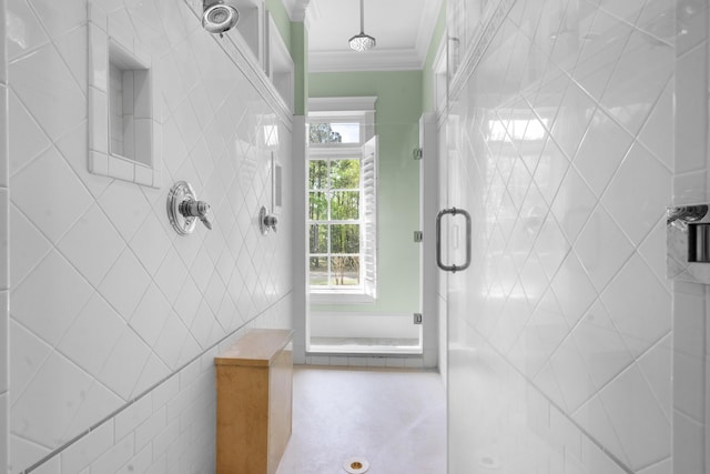 bathroom with a shower stall and ornamental molding