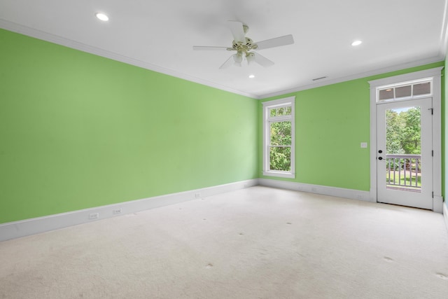 spare room with baseboards, ornamental molding, a ceiling fan, recessed lighting, and carpet flooring
