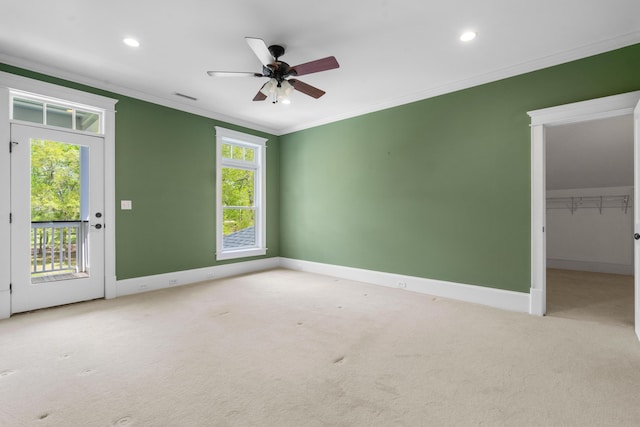 carpeted empty room with crown molding, baseboards, a ceiling fan, and recessed lighting