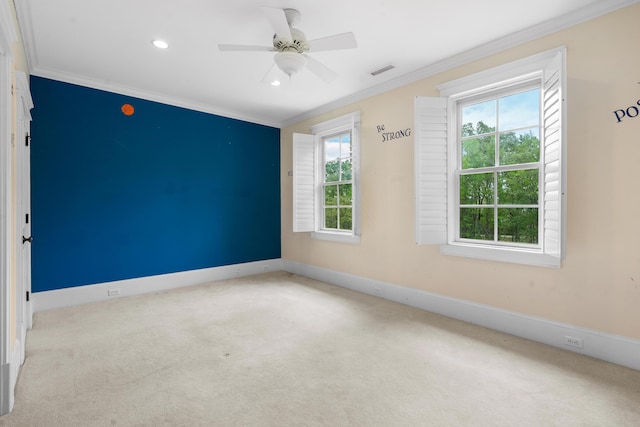 carpeted spare room featuring visible vents, baseboards, ceiling fan, crown molding, and recessed lighting
