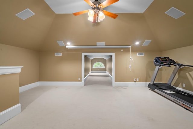 exercise area featuring visible vents, carpet flooring, and lofted ceiling