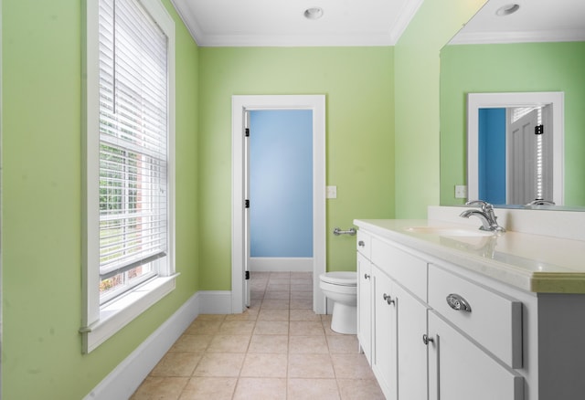 bathroom featuring toilet, tile patterned floors, vanity, and ornamental molding