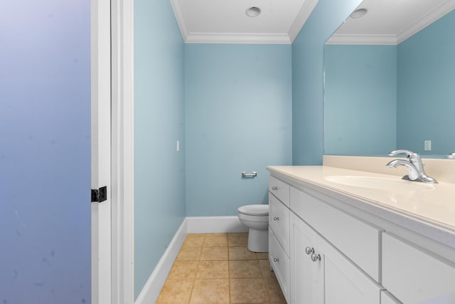 bathroom featuring vanity, baseboards, tile patterned floors, crown molding, and toilet