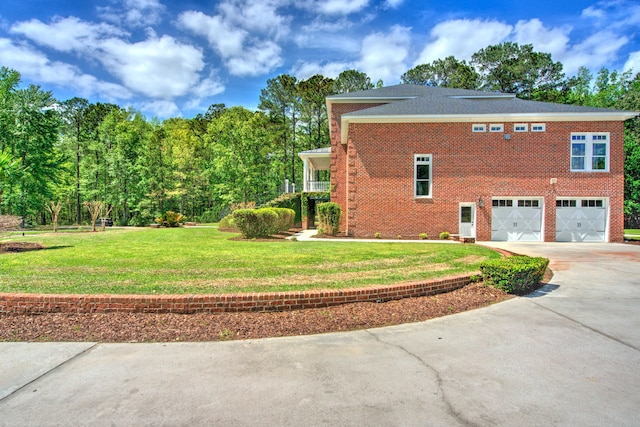 view of home's exterior featuring an attached garage, driveway, brick siding, and a lawn