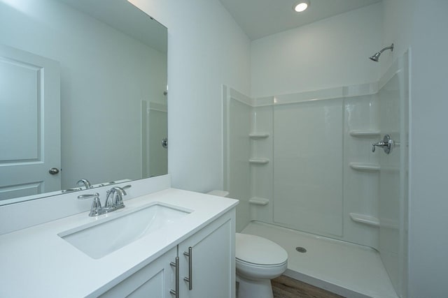 902 Twin Rivers Dr, Wando, SC 29492 - bathroom featuring vanity, walk in shower, wood finished floors, and toilet
