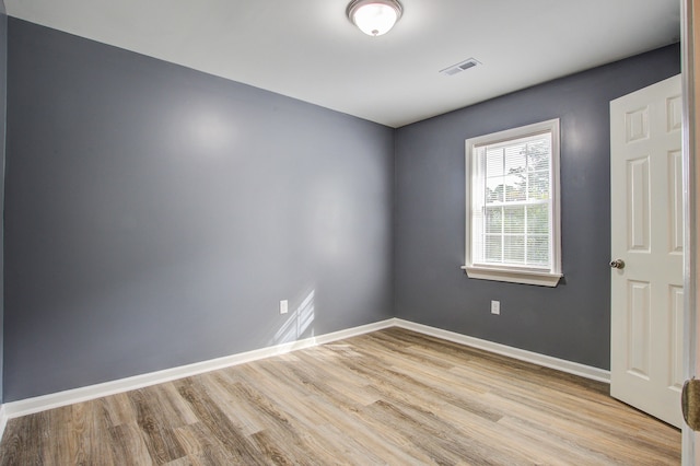 unfurnished room featuring light wood-type flooring