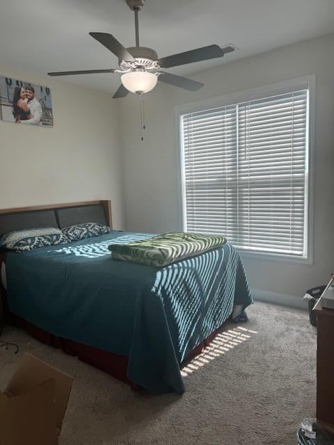 carpeted bedroom featuring ceiling fan