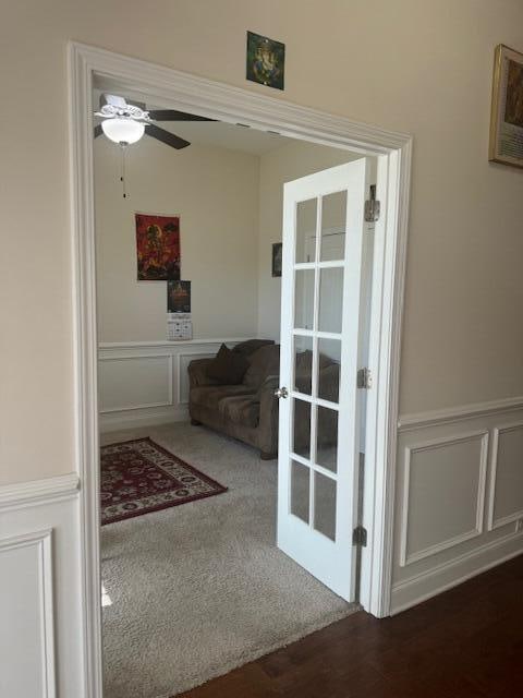 entryway featuring dark hardwood / wood-style flooring, ceiling fan, and french doors