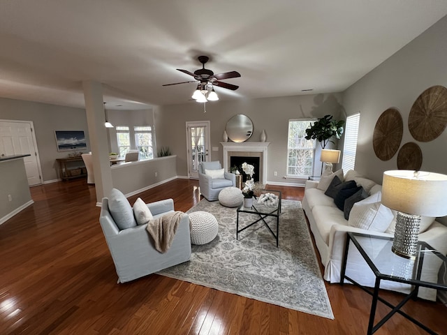 living room with dark hardwood / wood-style floors and ceiling fan