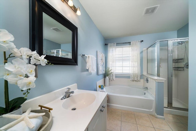 bathroom featuring vanity, tile patterned floors, and shower with separate bathtub