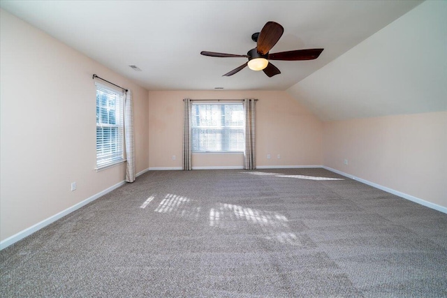 bonus room with vaulted ceiling, carpet flooring, and ceiling fan