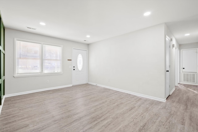 entrance foyer with recessed lighting, visible vents, light wood-style flooring, and baseboards