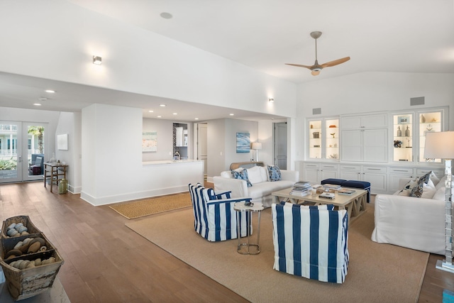 living room with lofted ceiling, ceiling fan, french doors, and hardwood / wood-style flooring