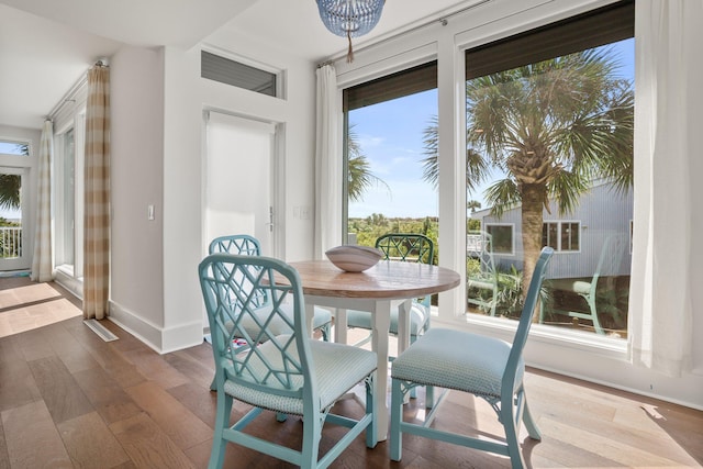 dining area featuring dark wood-type flooring