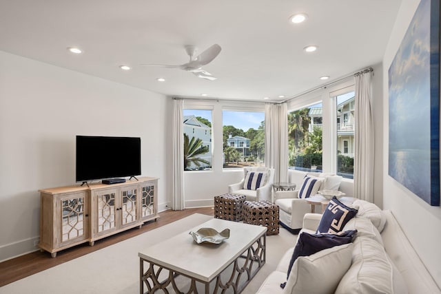 living room with ceiling fan and hardwood / wood-style floors