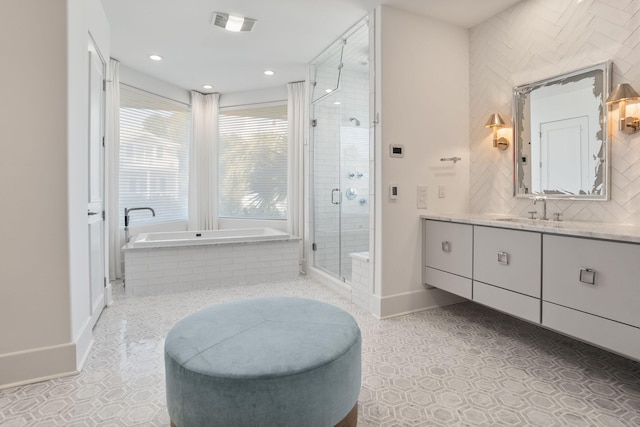 bathroom with vanity, plus walk in shower, and tile patterned floors