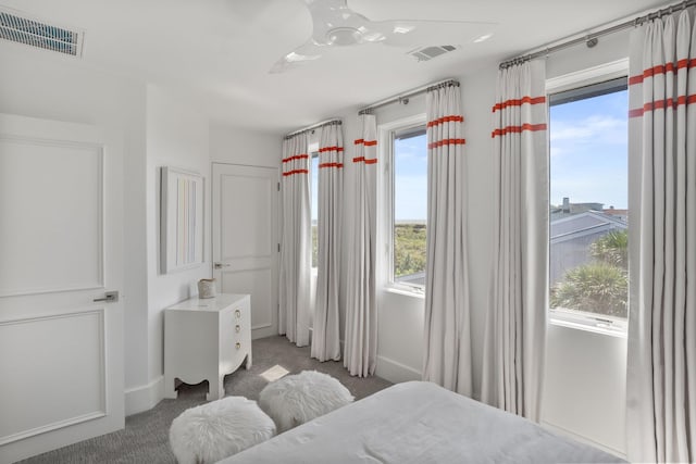 bedroom with multiple windows, carpet, and ceiling fan