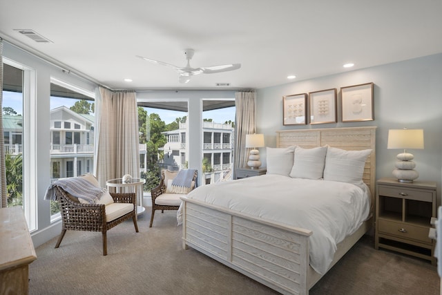 bedroom with dark carpet and ceiling fan